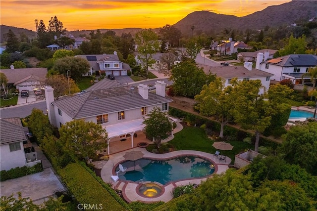 1280 Dumaine Ave, Oak Park, CA 91377 - aerial perspective of suburban area featuring a mountainous background and a pool area