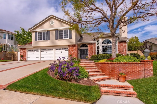 1280 Dumaine Ave, Oak Park, CA 91377 - view of front of property with an attached garage, brick siding, and driveway