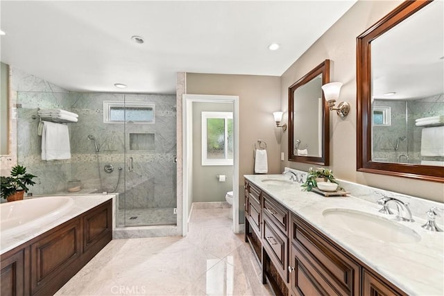 1280 Dumaine Ave, Oak Park, CA 91377 - bathroom with a shower stall, toilet, a garden tub, double vanity, and baseboards