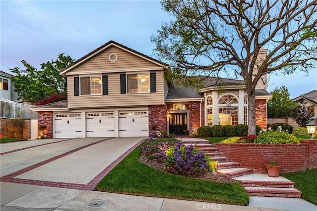 1280 Dumaine Ave, Oak Park, CA 91377 - traditional home featuring an attached garage, brick siding, and driveway