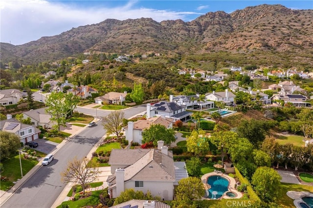 1280 Dumaine Ave, Oak Park, CA 91377 - aerial perspective of suburban area with a mountainous background and a pool area