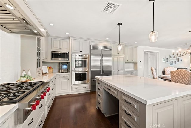 1280 Dumaine Ave, Oak Park, CA 91377 - kitchen with built in appliances, extractor fan, light countertops, dark wood finished floors, and white cabinetry