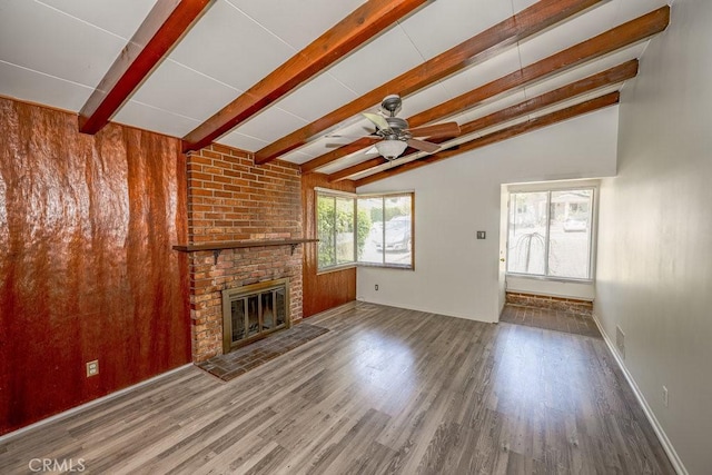 unfurnished living room featuring wood finished floors, a fireplace, ceiling fan, and baseboards