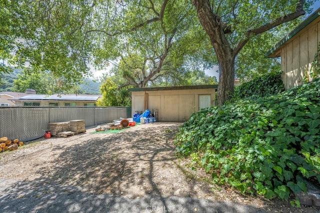 view of patio featuring fence