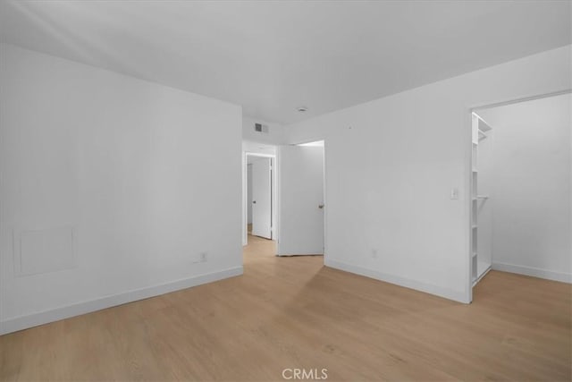14937 Dickens St Unit 209, Sherman Oaks, CA 91403 - spare room featuring light wood-style floors and baseboards