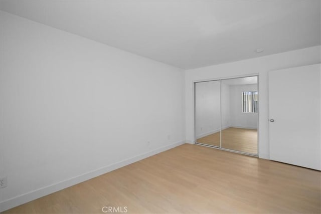 14937 Dickens St Unit 209, Sherman Oaks, CA 91403 - unfurnished bedroom featuring light wood-style floors, baseboards, and a closet