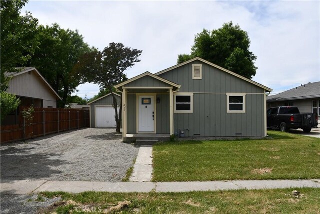 635 N Plumas St, Willows, CA 95988 - view of front of home featuring an outbuilding, board and batten siding, and driveway