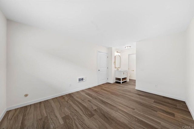 3825 Van Dyke Ave, San Diego, CA 92105 - empty room with dark wood finished floors and baseboards