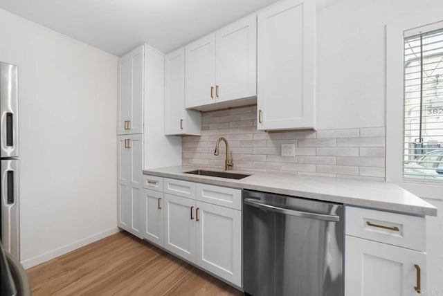 3825 Van Dyke Ave, San Diego, CA 92105 - kitchen with appliances with stainless steel finishes, a sink, plenty of natural light, and light countertops