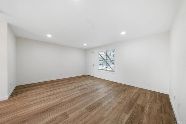 3825 Van Dyke Ave, San Diego, CA 92105 - spare room featuring light wood-style flooring, baseboards, and recessed lighting
