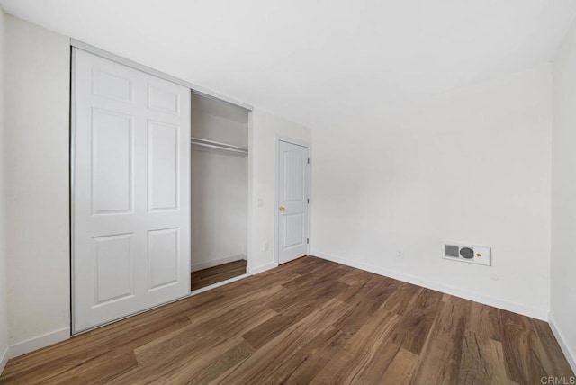 3825 Van Dyke Ave, San Diego, CA 92105 - unfurnished bedroom with wood finished floors, baseboards, and a closet