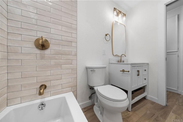 3825 Van Dyke Ave, San Diego, CA 92105 - bathroom with wood finished floors, a tub, baseboards, and toilet
