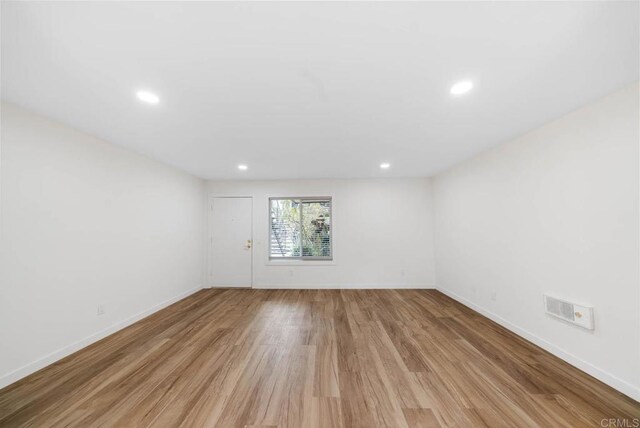 3825 Van Dyke Ave, San Diego, CA 92105 - spare room featuring light wood-type flooring, recessed lighting, and baseboards