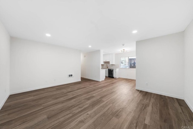 3825 Van Dyke Ave, San Diego, CA 92105 - unfurnished living room featuring wood finished floors, baseboards, and recessed lighting