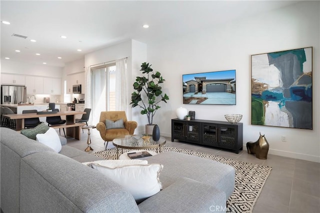 56231 Platinum Way, La Quinta, CA 92253 - living room featuring baseboards, recessed lighting, and light tile patterned floors