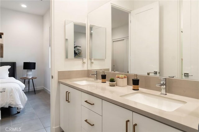 56231 Platinum Way, La Quinta, CA 92253 - bathroom featuring baseboards, tile patterned floors, double vanity, and recessed lighting