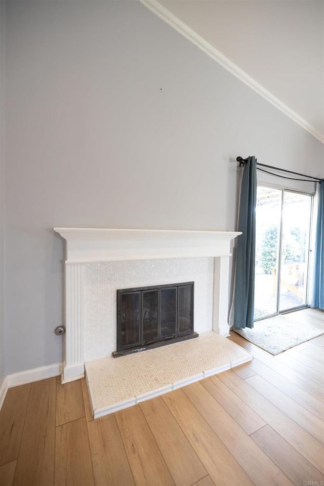 4843 Sumac Pl, Oceanside, CA 92057 - detailed view of wood finished floors, a fireplace with raised hearth, ornamental molding, and baseboards