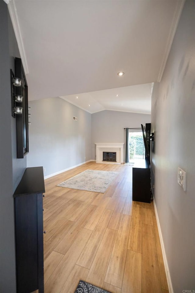 4843 Sumac Pl, Oceanside, CA 92057 - unfurnished living room featuring light wood-style flooring, vaulted ceiling, baseboards, crown molding, and recessed lighting