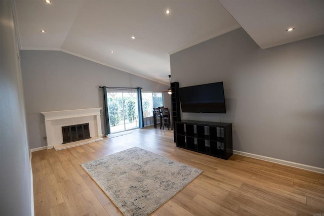 4843 Sumac Pl, Oceanside, CA 92057 - living room with vaulted ceiling, baseboards, light wood finished floors, a glass covered fireplace, and recessed lighting