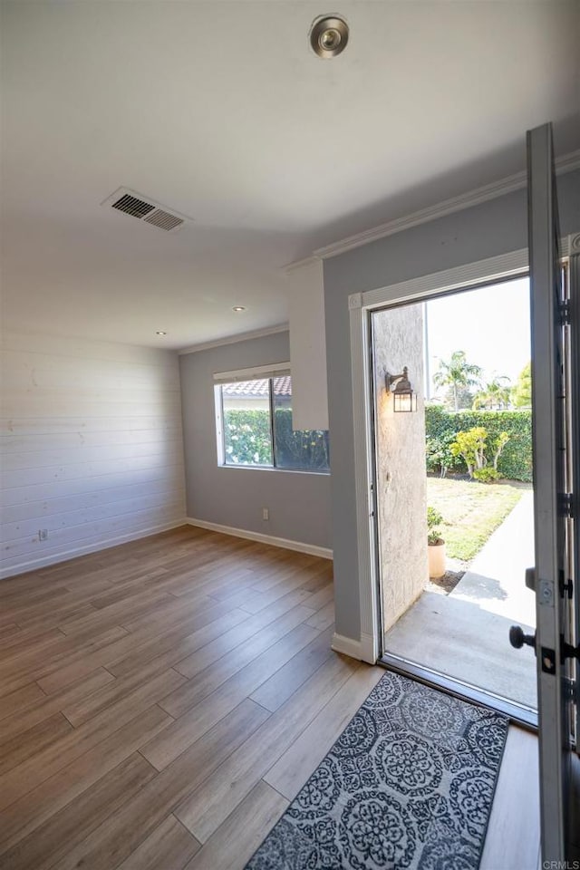 4843 Sumac Pl, Oceanside, CA 92057 - foyer with light wood-type flooring, crown molding, and baseboards