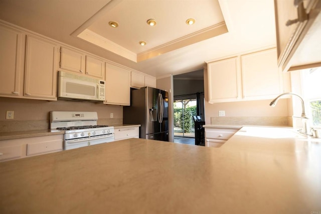 4843 Sumac Pl, Oceanside, CA 92057 - kitchen with white appliances, a raised ceiling, a sink, light countertops, and recessed lighting