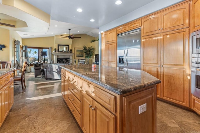 28623 Willow Park Rd, Escondido, CA 92026 - kitchen featuring a ceiling fan, built in appliances, a kitchen island, recessed lighting, and vaulted ceiling