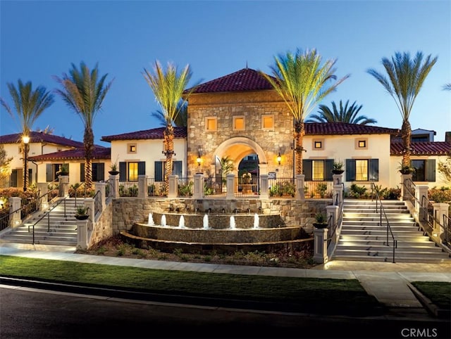 104 Scenic Crst, Irvine, CA 92618 - mediterranean / spanish house featuring stucco siding, stairway, fence, and stone siding