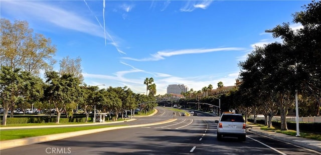 104 Scenic Crst, Irvine, CA 92618 - view of asphalt street featuring sidewalks, street lights, and curbs