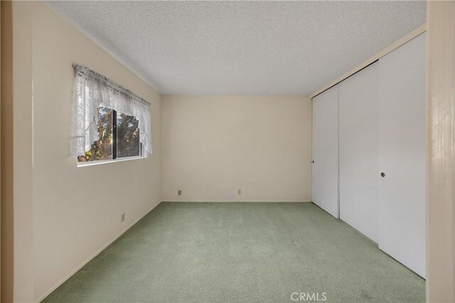 2622 N Tustin Ave Unit 147, Santa Ana, CA 92705 - unfurnished bedroom with light carpet, a textured ceiling, and a closet