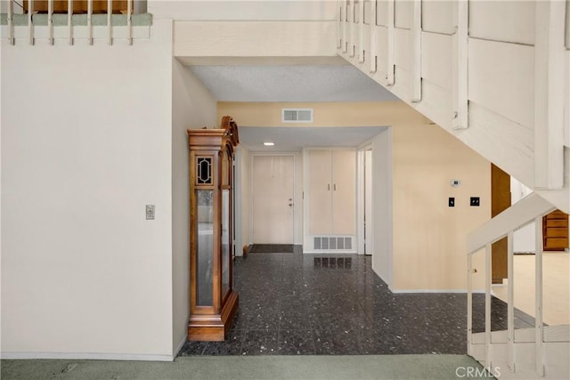 2622 N Tustin Ave Unit 147, Santa Ana, CA 92705 - corridor with baseboards and speckle patterned floor