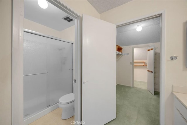 2622 N Tustin Ave Unit 147, Santa Ana, CA 92705 - full bath featuring a textured ceiling, a stall shower, toilet, a walk in closet, and vanity