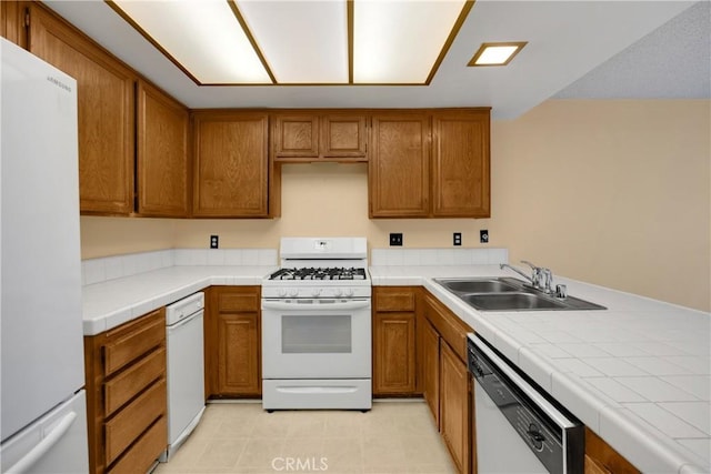 2622 N Tustin Ave Unit 147, Santa Ana, CA 92705 - kitchen with white appliances, a sink, brown cabinets, and tile counters