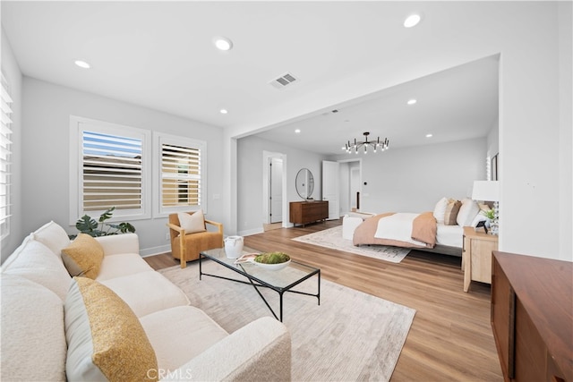 110 Mulberry, Lake Forest, CA 92630 - living area featuring recessed lighting, a chandelier, light wood finished floors, and baseboards