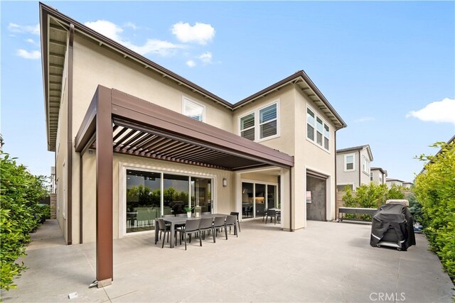 110 Mulberry, Lake Forest, CA 92630 - rear view of property featuring stucco siding, a patio area, and outdoor dining area