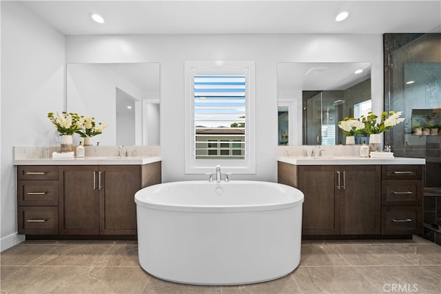 110 Mulberry, Lake Forest, CA 92630 - full bath featuring a shower stall, two vanities, a freestanding bath, and recessed lighting