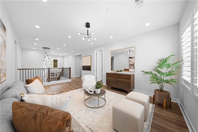110 Mulberry, Lake Forest, CA 92630 - living room featuring wood finished floors, a chandelier, recessed lighting, and baseboards