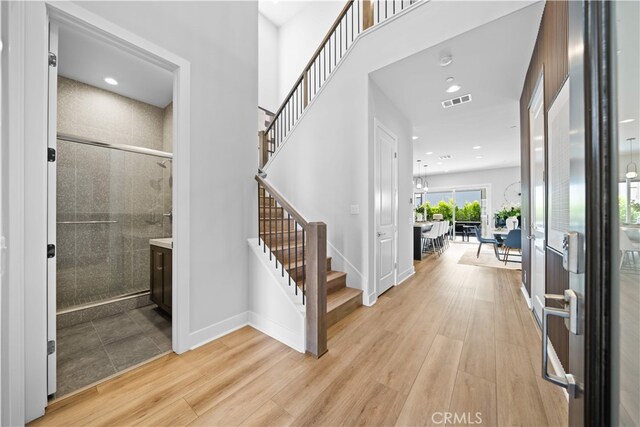 110 Mulberry, Lake Forest, CA 92630 - entryway featuring light wood-type flooring, stairway, baseboards, and recessed lighting