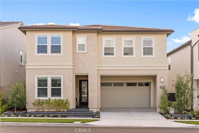 110 Mulberry, Lake Forest, CA 92630 - view of front facade with concrete driveway, a garage, and stucco siding