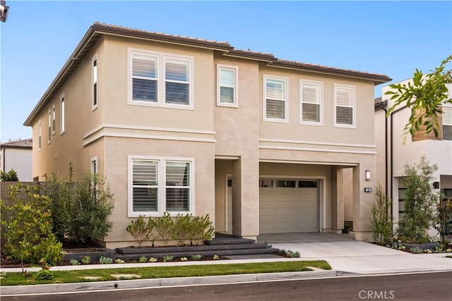 110 Mulberry, Lake Forest, CA 92630 - view of front of home featuring a garage, concrete driveway, and stucco siding
