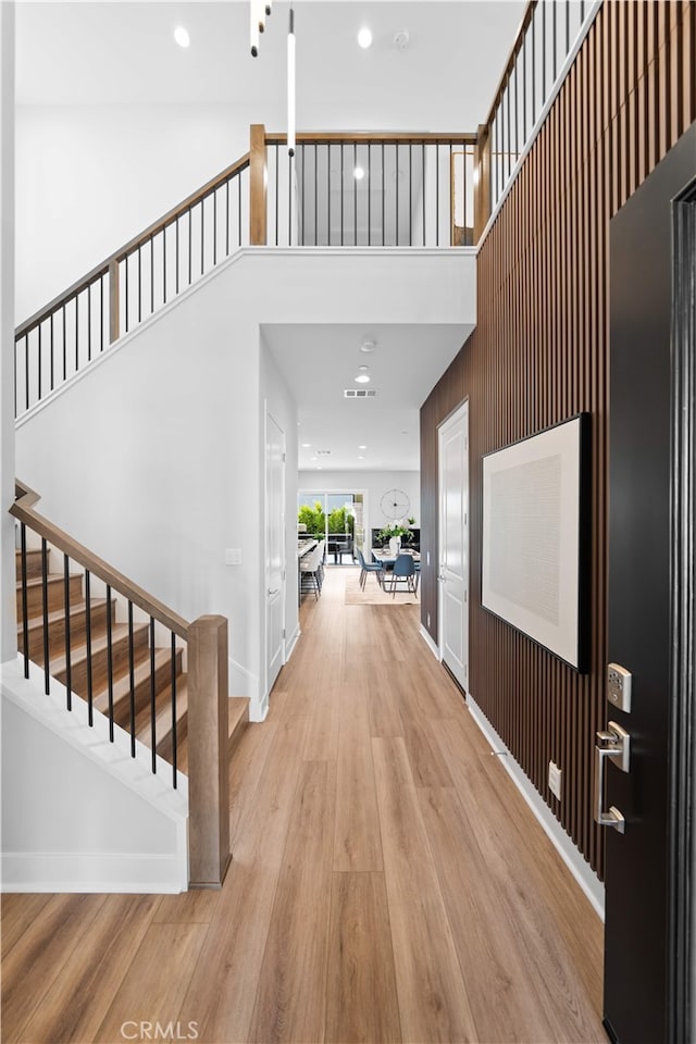 110 Mulberry, Lake Forest, CA 92630 - foyer entrance featuring a high ceiling, stairs, light wood-type flooring, recessed lighting, and baseboards