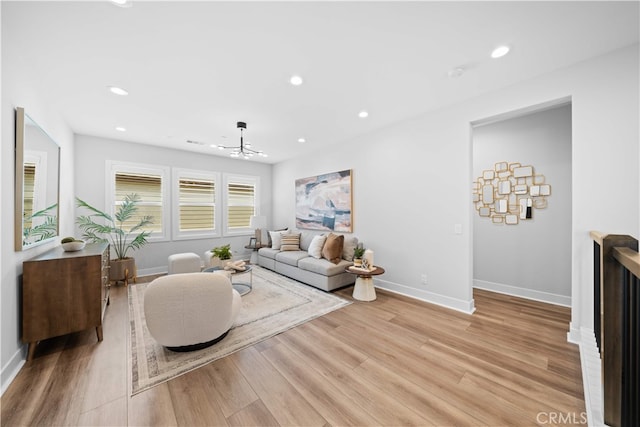 110 Mulberry, Lake Forest, CA 92630 - living area with light wood-style floors, a chandelier, recessed lighting, and baseboards
