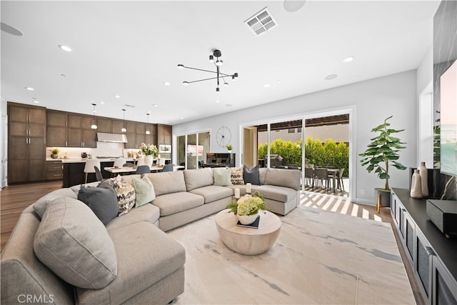 110 Mulberry, Lake Forest, CA 92630 - living room with recessed lighting, a chandelier, and wood finished floors