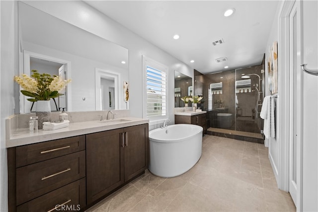 110 Mulberry, Lake Forest, CA 92630 - full bath featuring a shower stall, a freestanding bath, two vanities, and recessed lighting