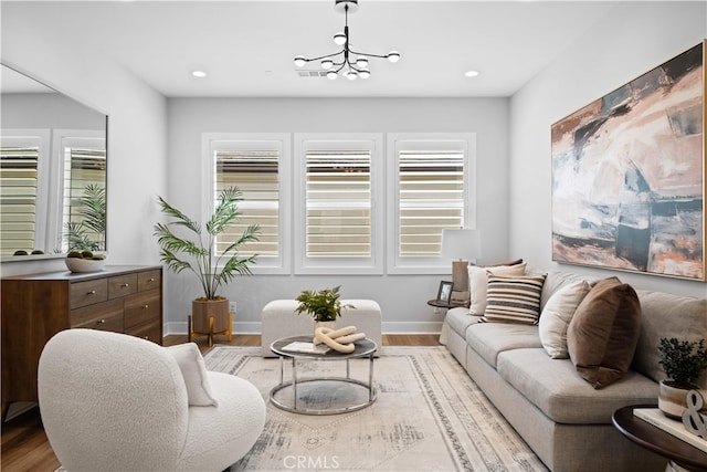 110 Mulberry, Lake Forest, CA 92630 - living area featuring wood finished floors, baseboards, recessed lighting, and a chandelier
