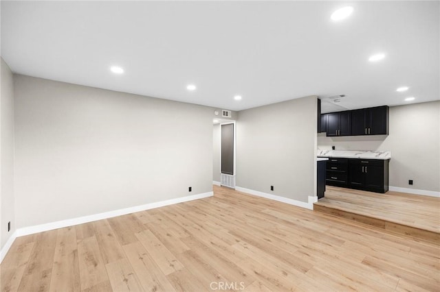 1000 Central Ave Unit 39, Riverside, CA 92507 - unfurnished living room featuring light wood-type flooring, baseboards, and recessed lighting