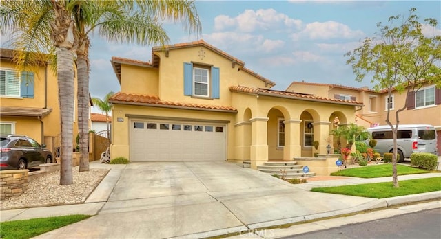 2551 Holly St, Fullerton, CA 92835 - mediterranean / spanish house with stucco siding, an attached garage, concrete driveway, and a tiled roof