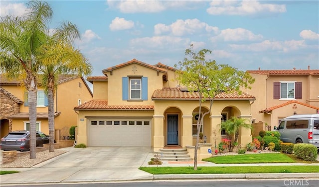 2551 Holly St, Fullerton, CA 92835 - mediterranean / spanish home featuring stucco siding, driveway, a garage, and a tiled roof