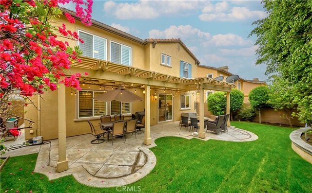 2551 Holly St, Fullerton, CA 92835 - back of property with stucco siding, a pergola, a patio area, and outdoor dining space