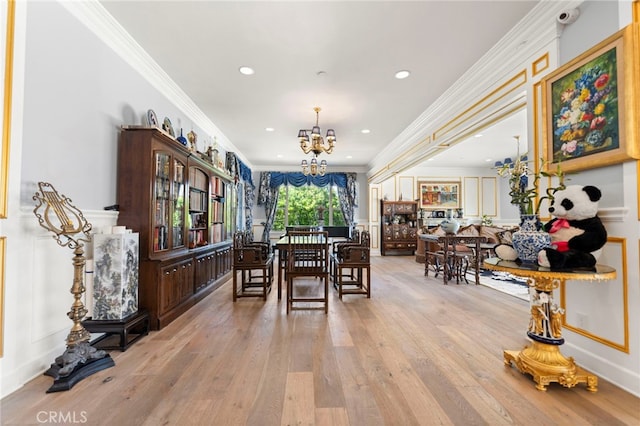 2825 Majestic St, West Covina, CA 91791 - dining area featuring a chandelier, crown molding, wood-type flooring, a decorative wall, and recessed lighting
