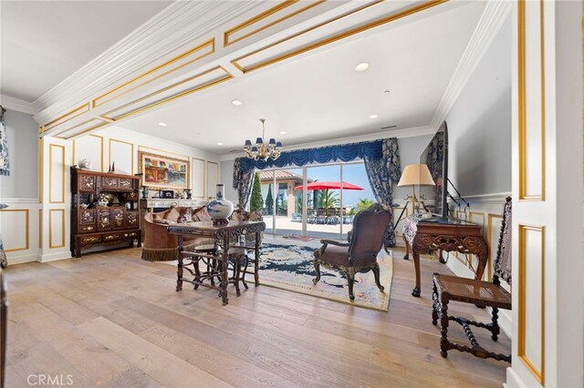 2825 Majestic St, West Covina, CA 91791 - dining space featuring ornamental molding, a decorative wall, a chandelier, hardwood / wood-style flooring, and a wainscoted wall